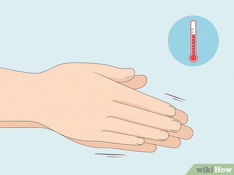 Step 4 Make sure your hands are warm before you touch her feet.